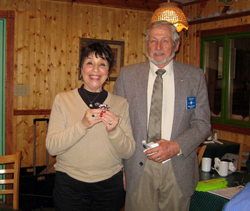 Theresa McCabe receives a Lion from Barker President Chris Czelusta