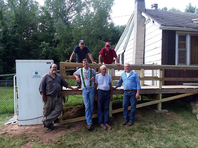 Barker Lions volunteers pose next to ramp